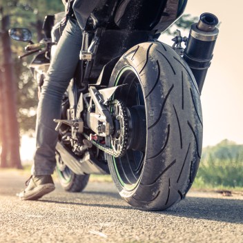 biker and motorbike ready to ride
